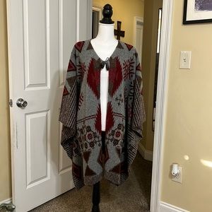 Fabulous warm poncho with reds, beige and browns!